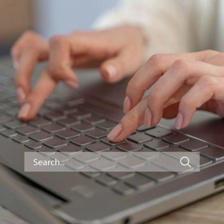 woman laptop keyboard search bar